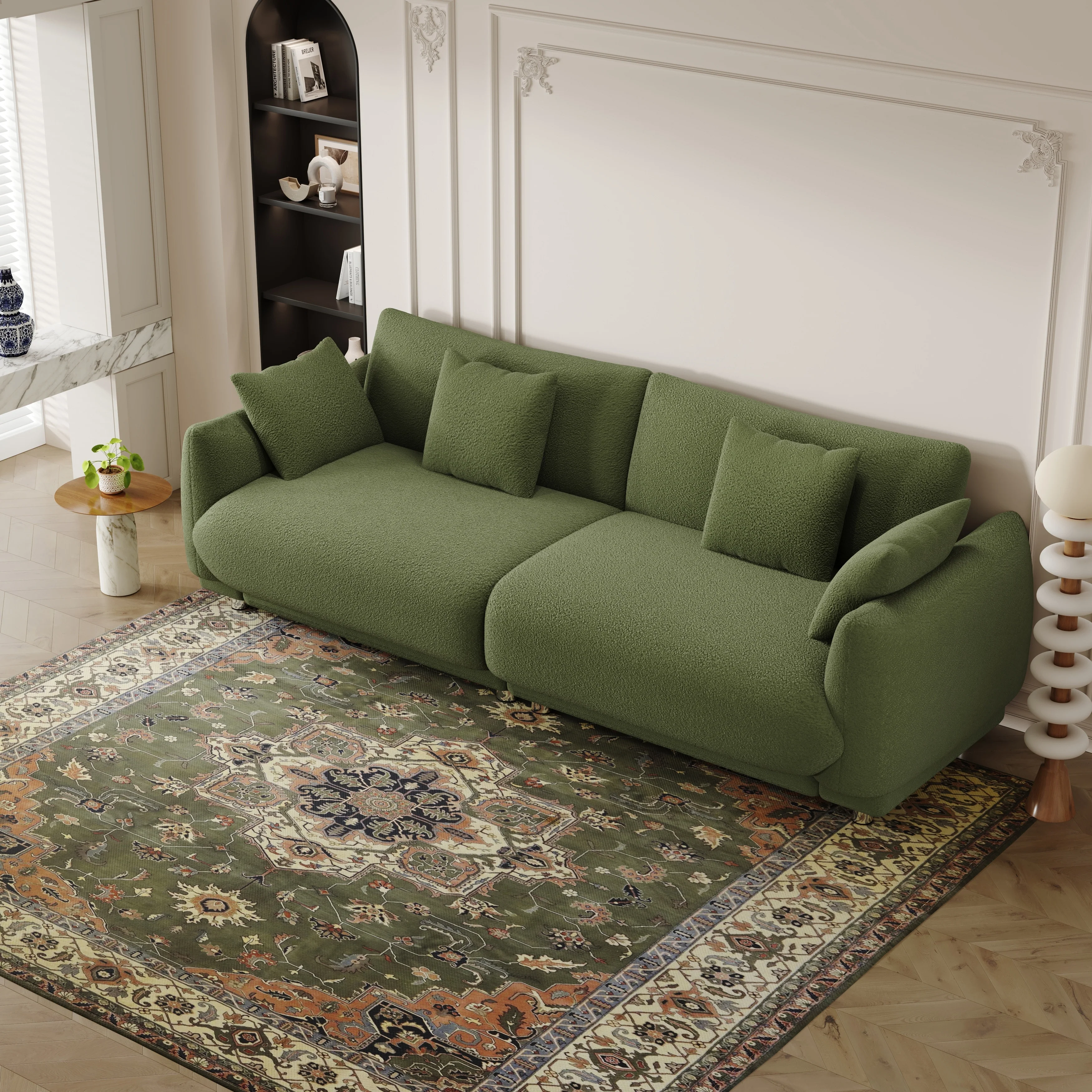 An 86.6-inch teddy wool green sofa with four throw pillows and hardware feet that can sit comfortably in an apartment bedroom wi