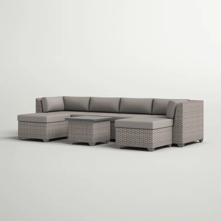 Amjad 7 Piece Outdoor Sectional Seating Group with Cushions